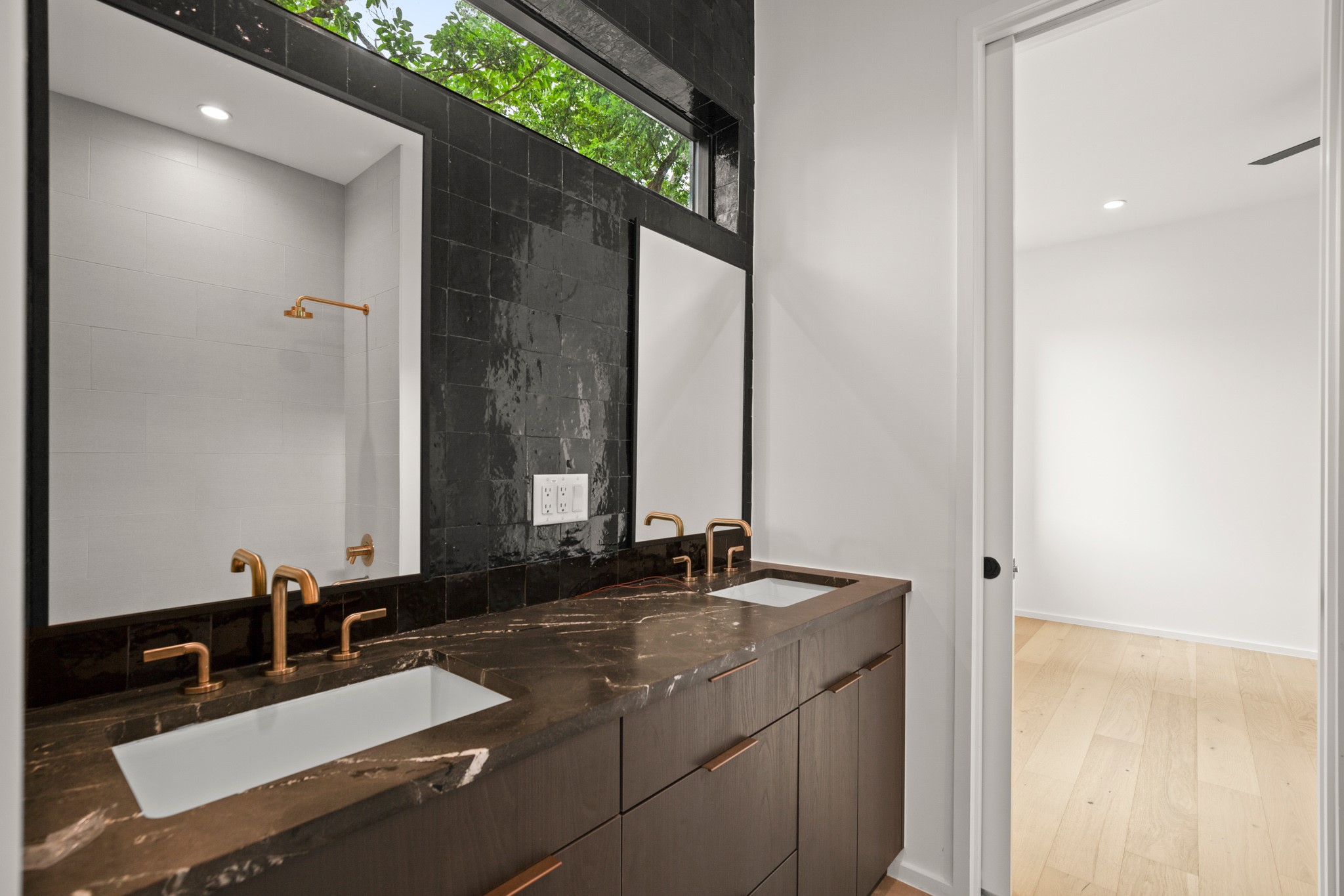 1805 Collier Street Austin, TX 78704 - Photo 27 of 40 a bathroom with a sink and a mirror