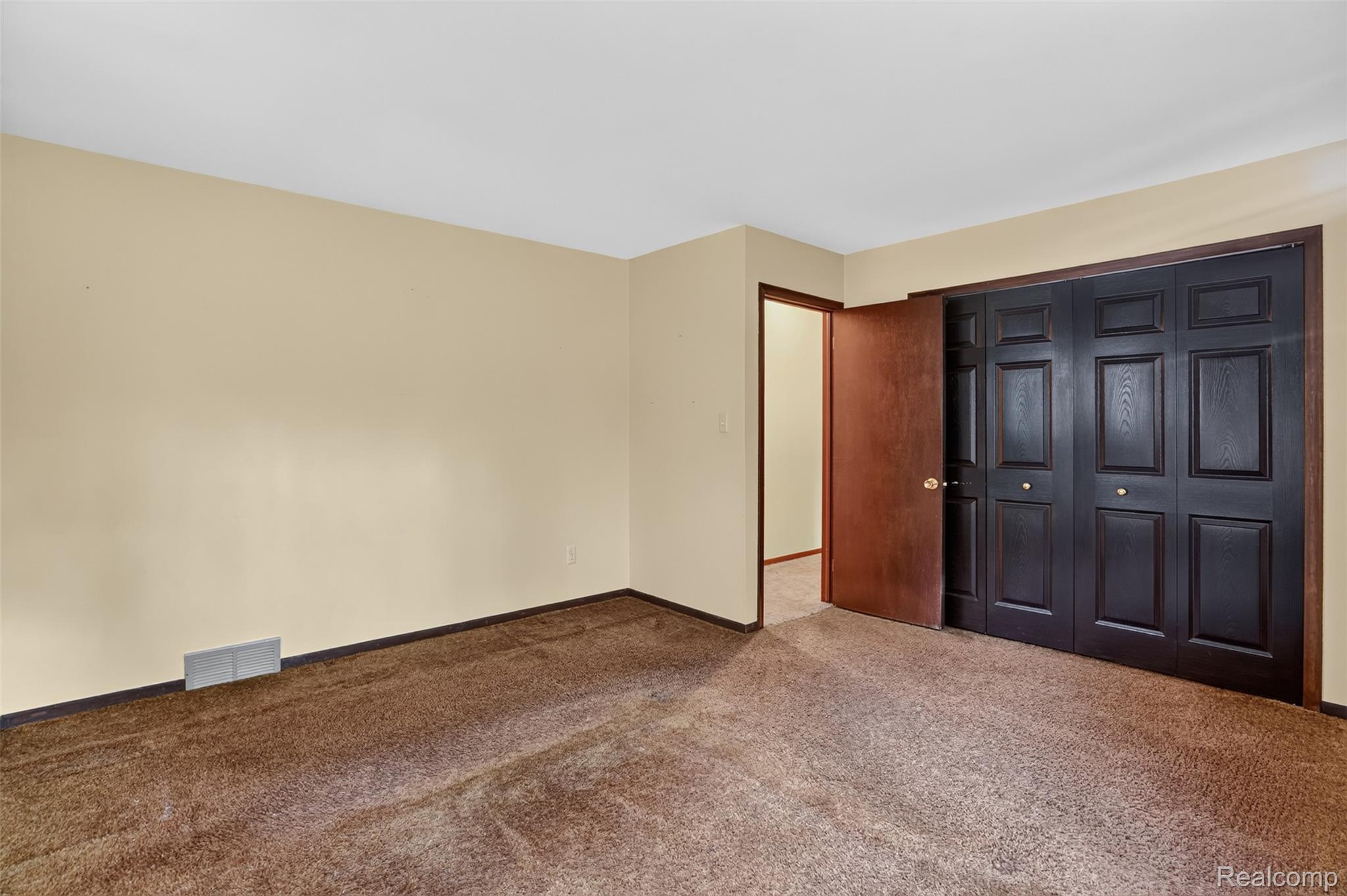 16955 English Road Manchester, MI 48158 - Photo 15 of 37 Neutral-toned walls complement the brown carpet flooring