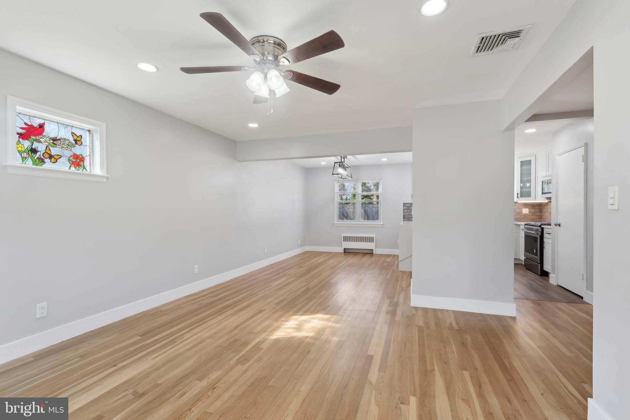 904 Big Oak Road Yardley, PA 19067 - Photo 14 of 56 wooden floor in an empty room with a window