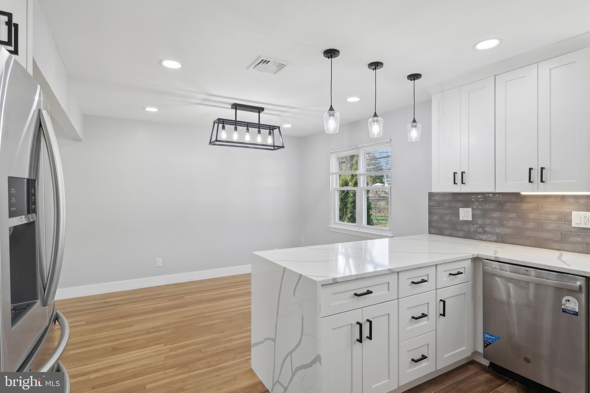 904 Big Oak Road Yardley, PA 19067 - Photo 22 of 56 a kitchen with granite countertop white cabinets and white appliances