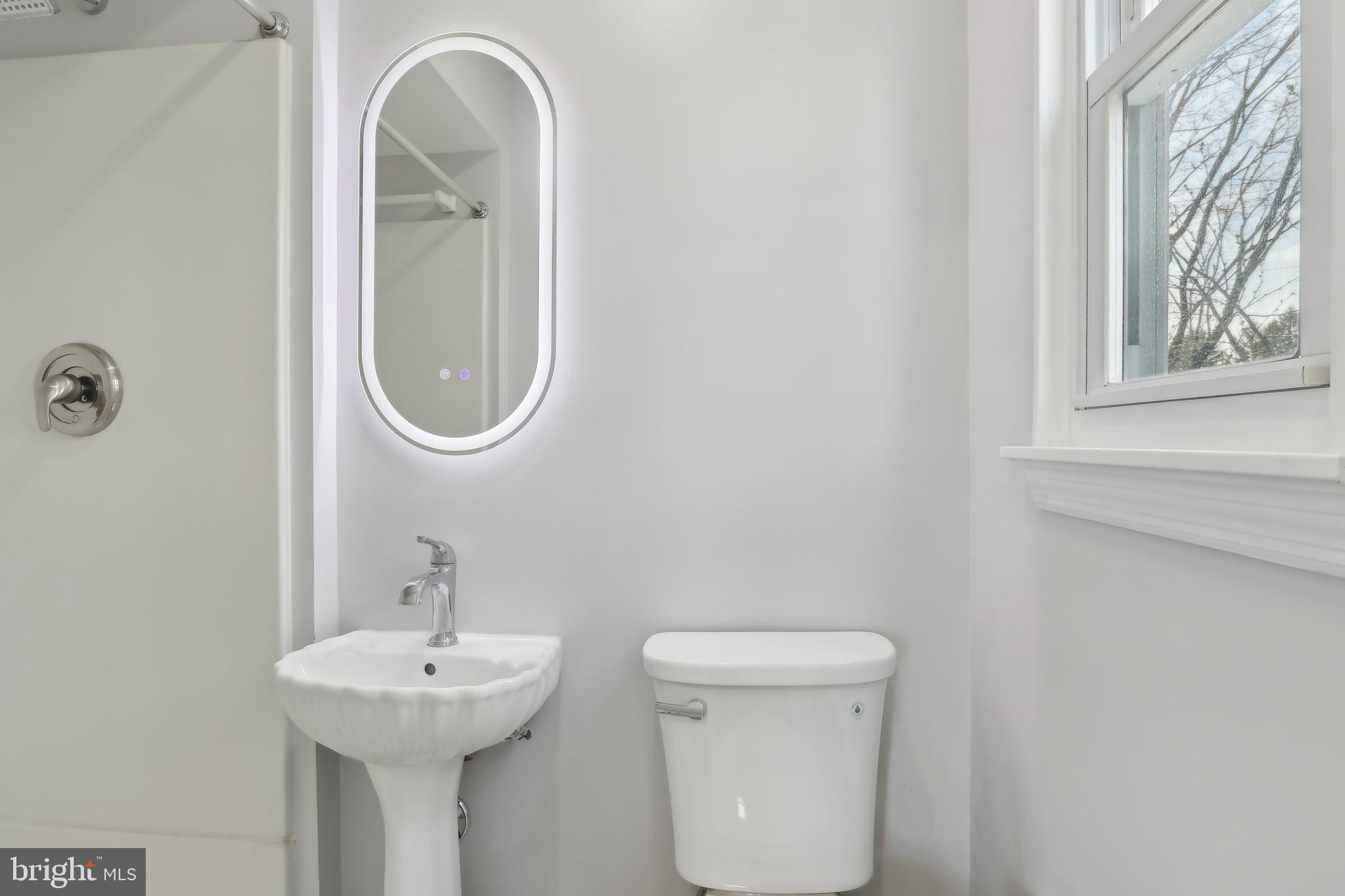 904 Big Oak Road Yardley, PA 19067 - Photo 28 of 56 a bathroom with a toilet sink and mirror