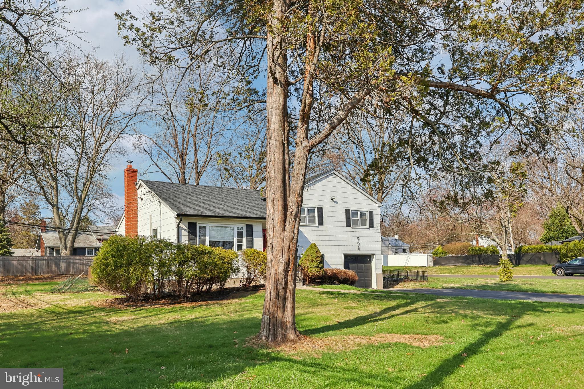 904 Big Oak Road Yardley, PA 19067 - Photo 3 of 56 a front view of a house with a yard