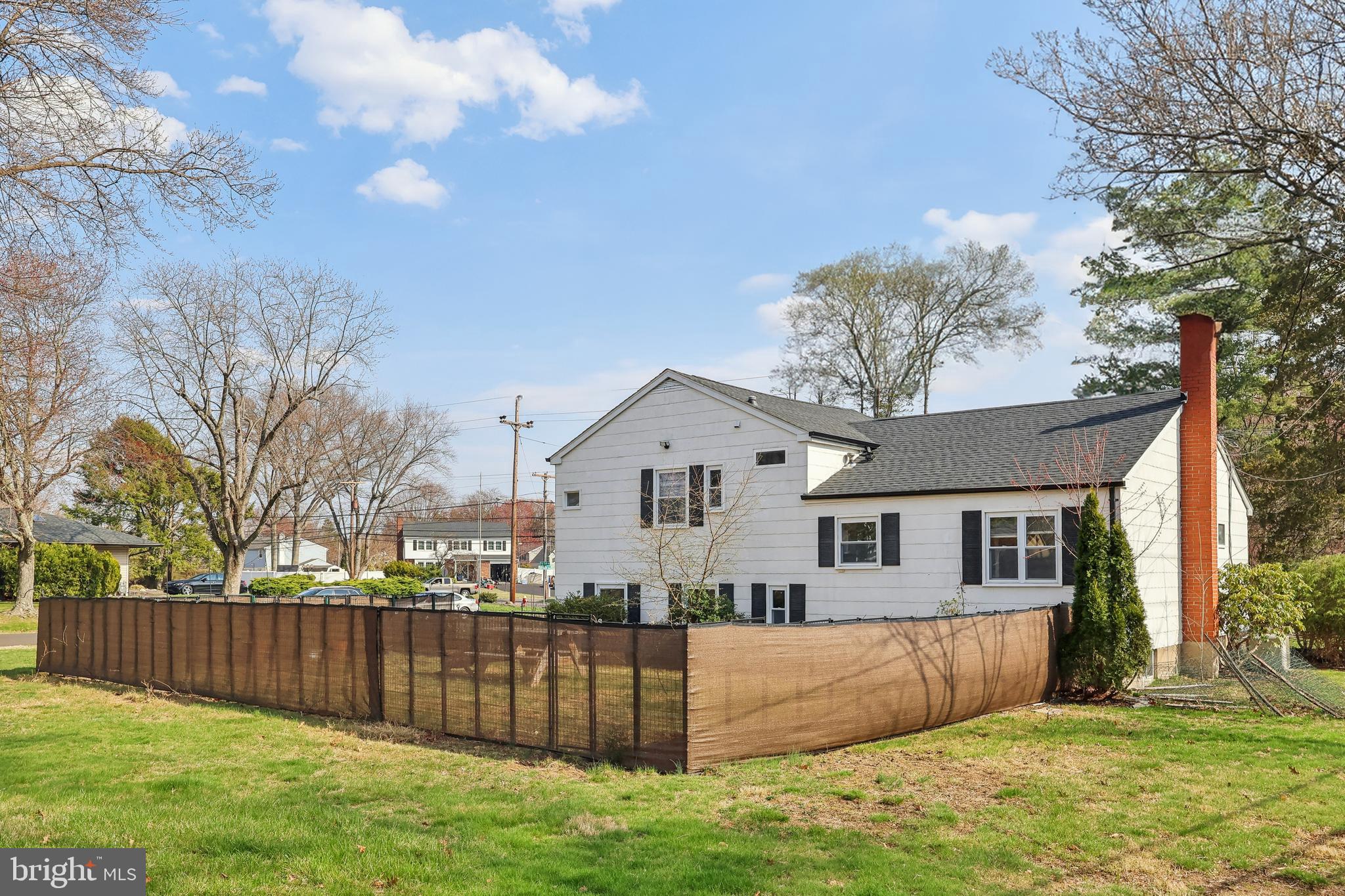 904 Big Oak Road Yardley, PA 19067 - Photo 34 of 56 a view of a house with a big yard and a large tree