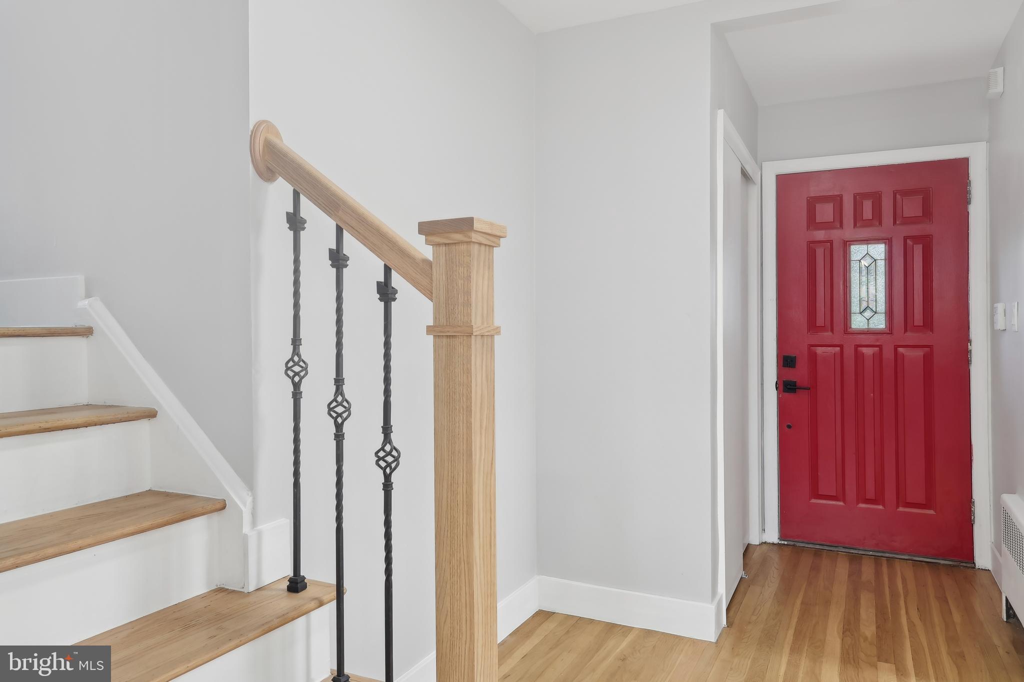 904 Big Oak Road Yardley, PA 19067 - Photo 5 of 56 a view of a hallway with wooden floor and entryway