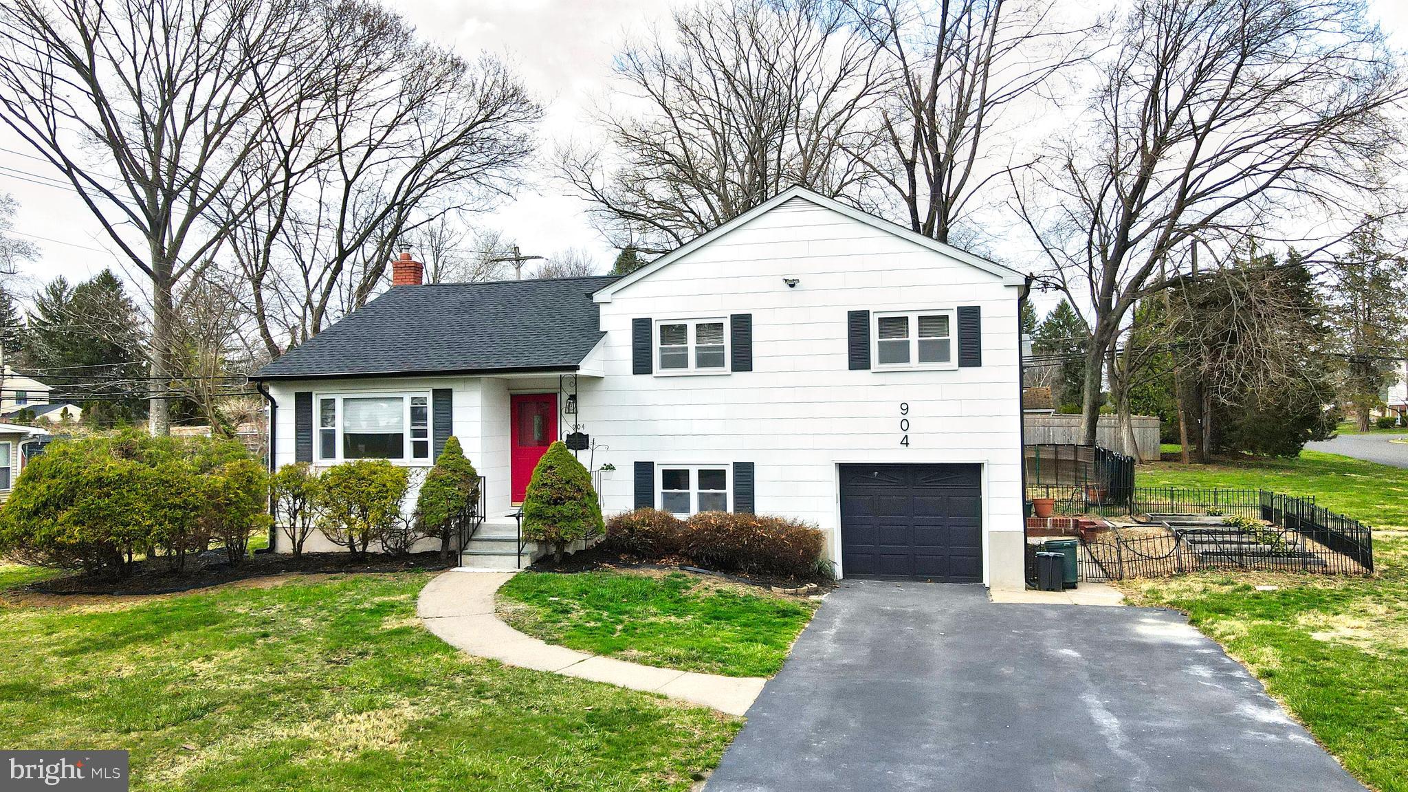 904 Big Oak Road Yardley, PA 19067 - Photo 55 of 56 a front view of a house with garden