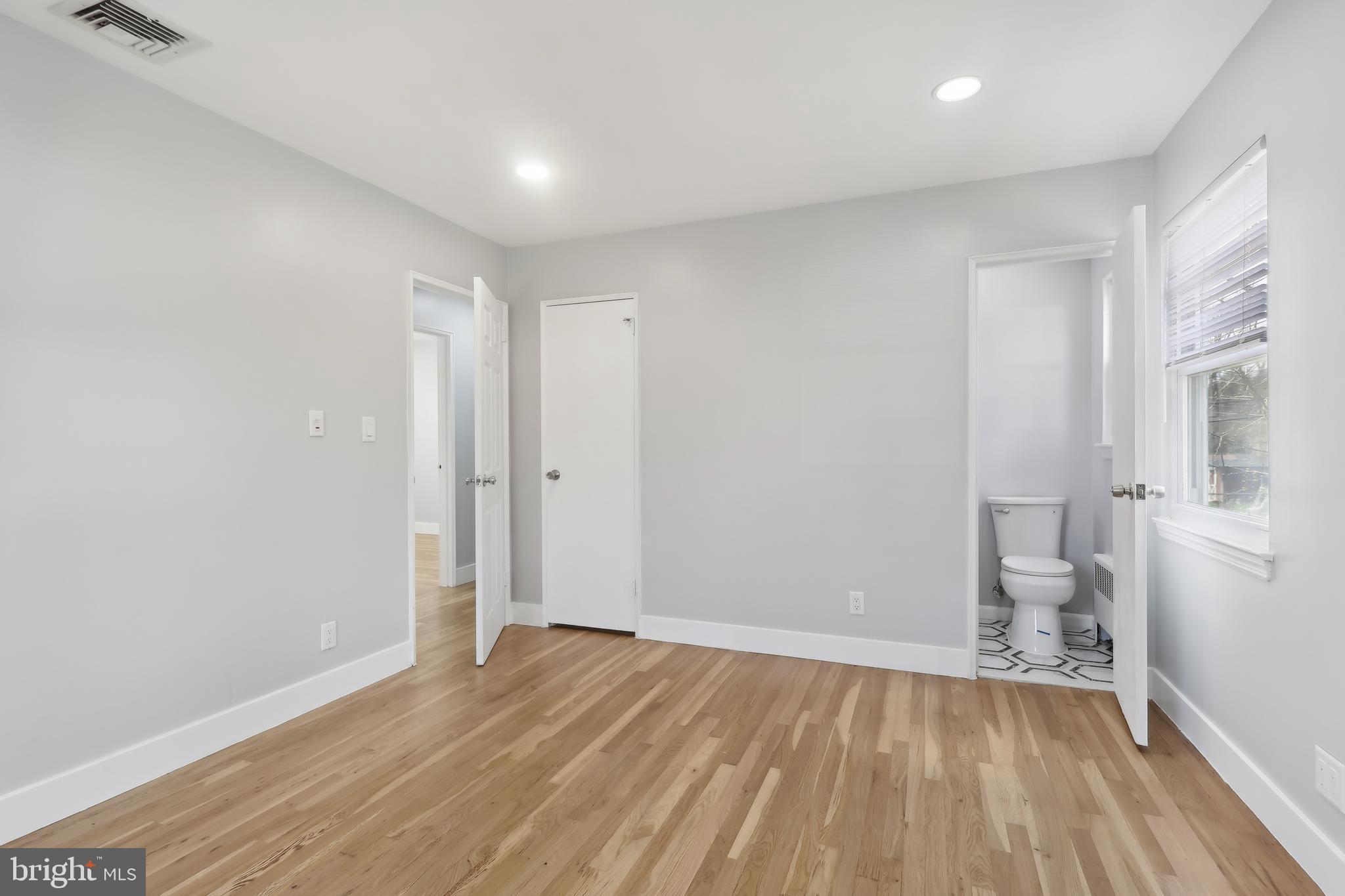 904 Big Oak Road Yardley, PA 19067 - Photo 6 of 56 a view of empty room with wooden floor
