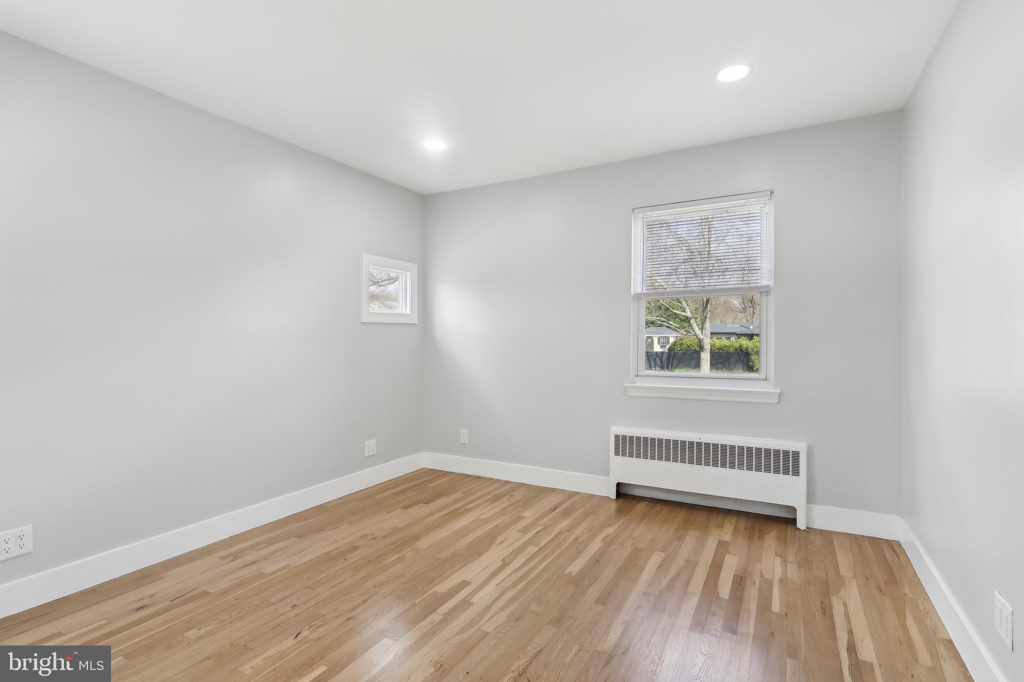 904 Big Oak Road Yardley, PA 19067 - Photo 7 of 56 a view of room with window and hardwood floor