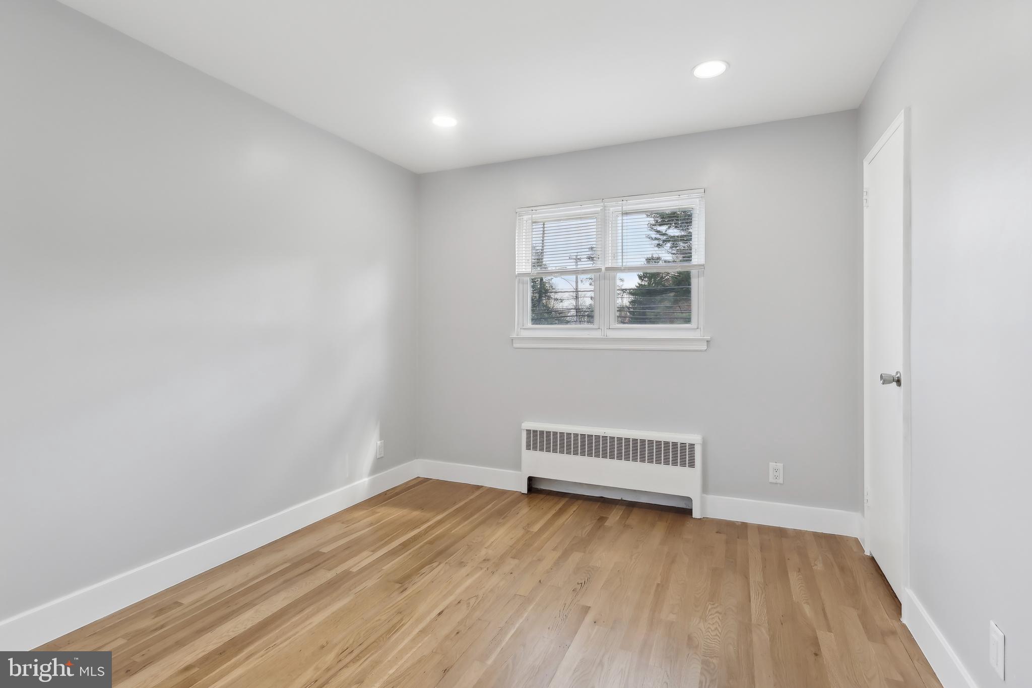 904 Big Oak Road Yardley, PA 19067 - Photo 9 of 56 a view of room with wooden floor and fan