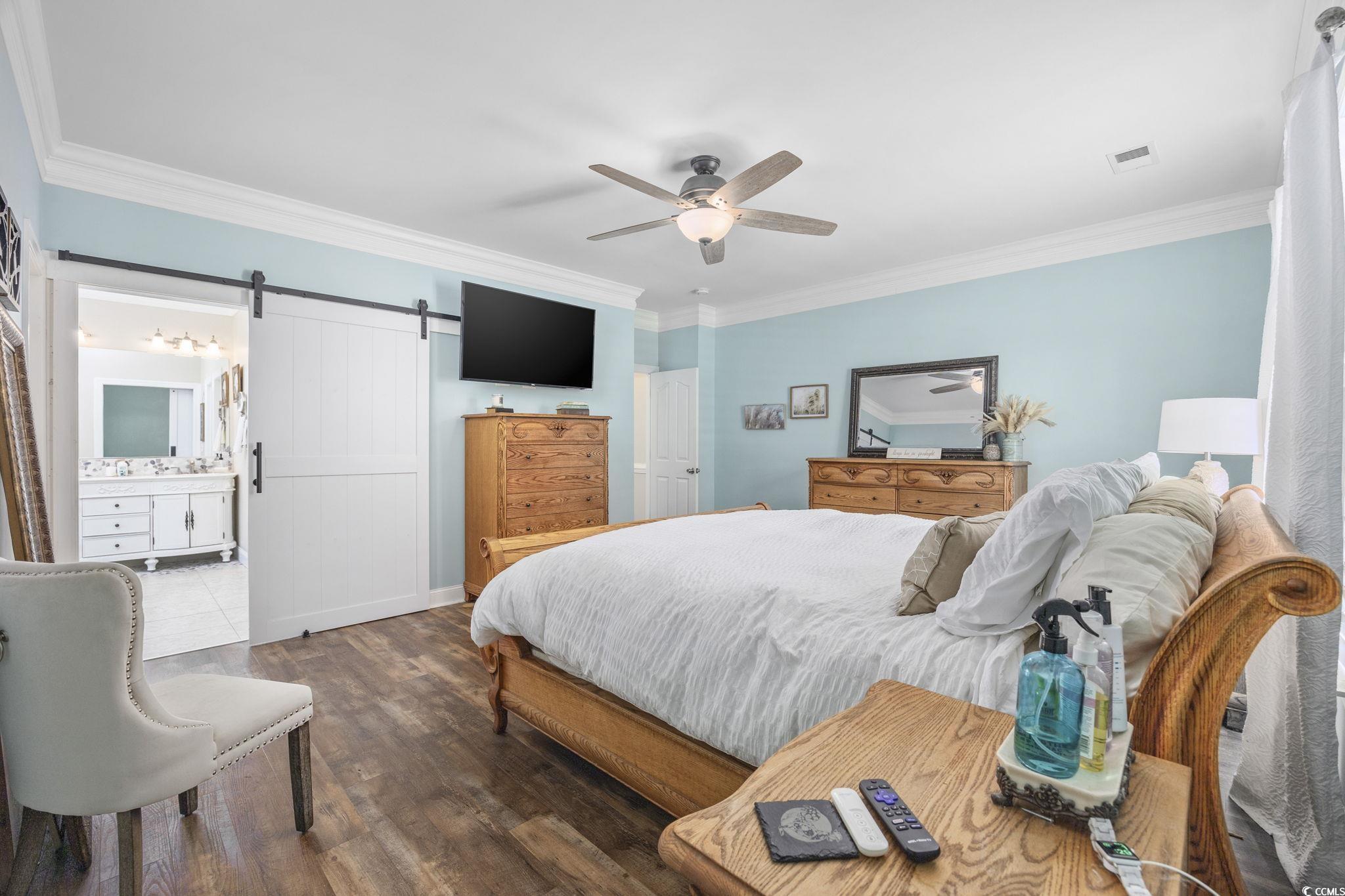 7005 Wellesly Court Murrells Inlet, SC 29576 - Photo 21 of 40 Bedroom featuring wood finished floors, ornamental