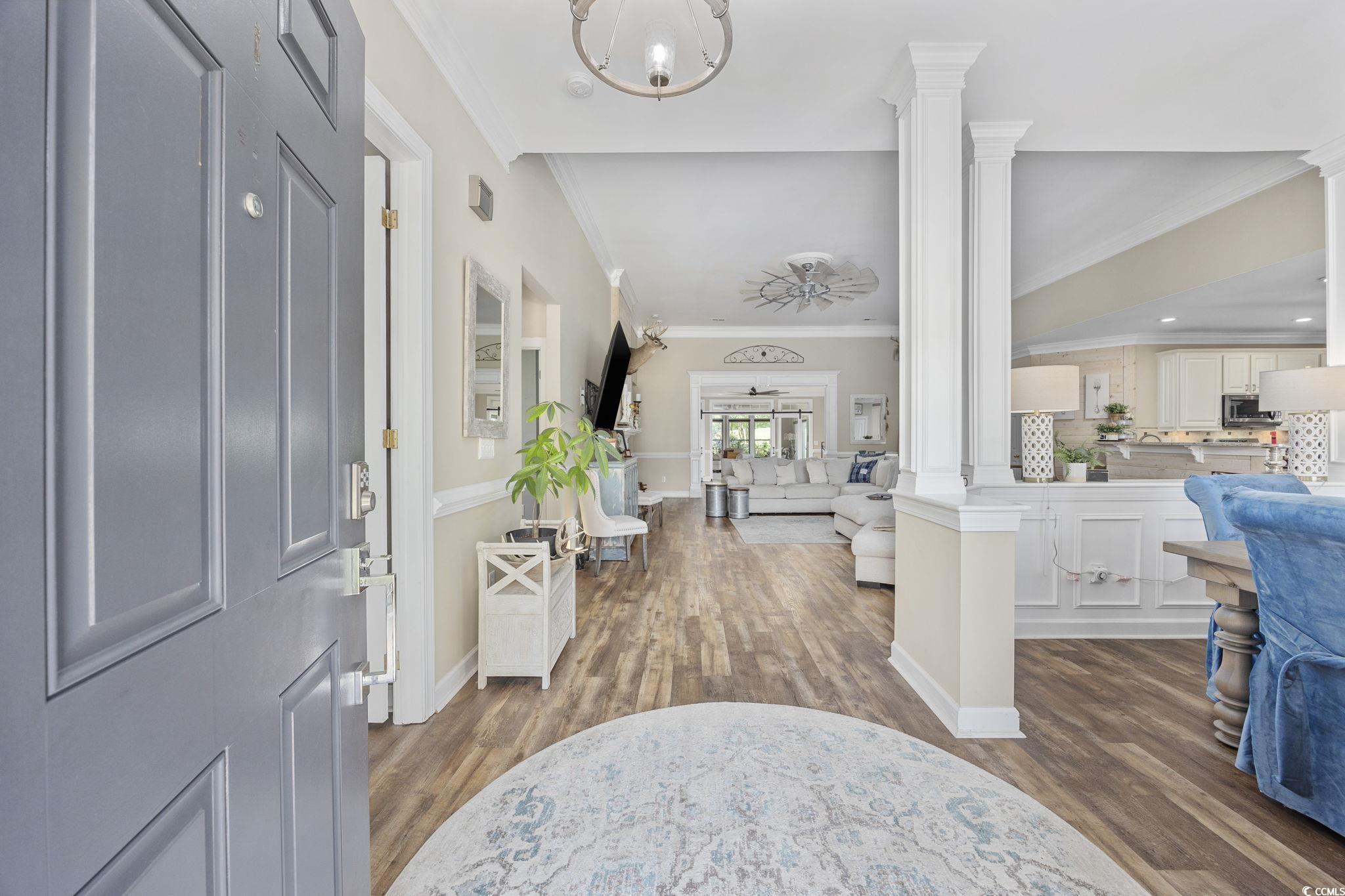 7005 Wellesly Court Murrells Inlet, SC 29576 - Photo 3 of 40 Entrance foyer featuring decorative columns, wood