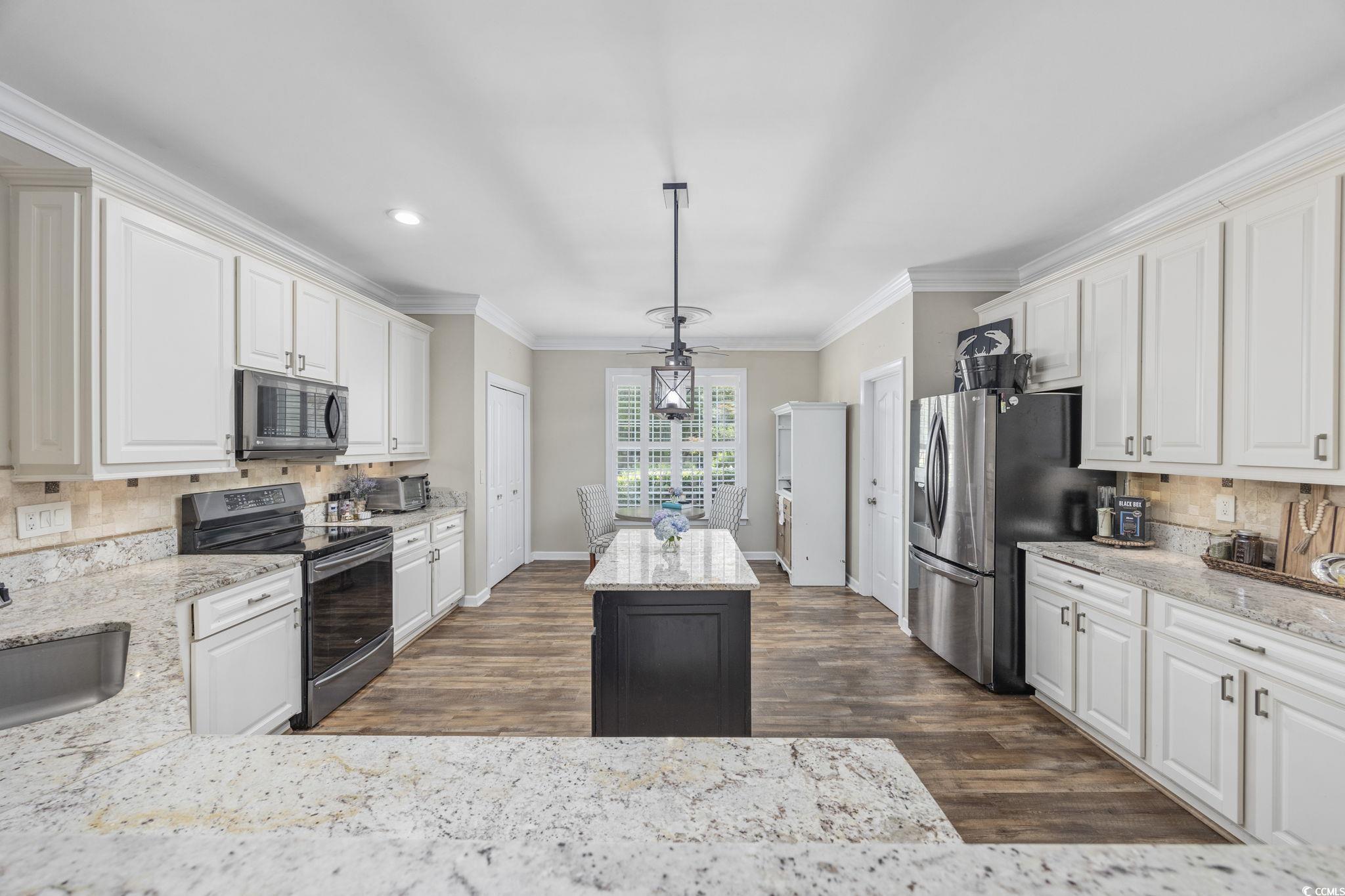 7005 Wellesly Court Murrells Inlet, SC 29576 - Photo 10 of 40 Kitchen with appliances with stainless steel finis