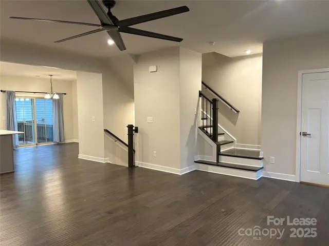 a view of a room with wooden floor