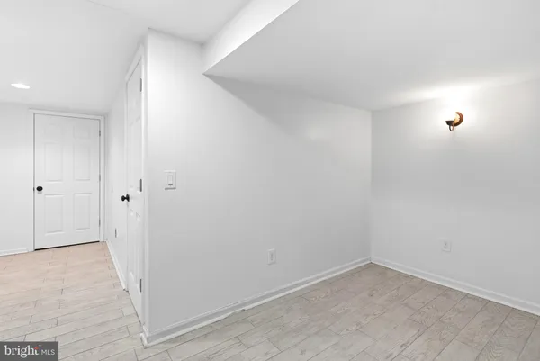 a bathroom with a sink mirror and toilet