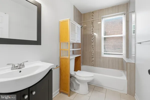 a kitchen with stainless steel appliances granite countertop a sink a stove and a wooden floors