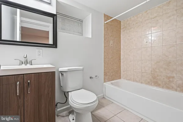 a view of a brick building next to a yard