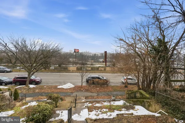 a picture of a bench in front of a wall