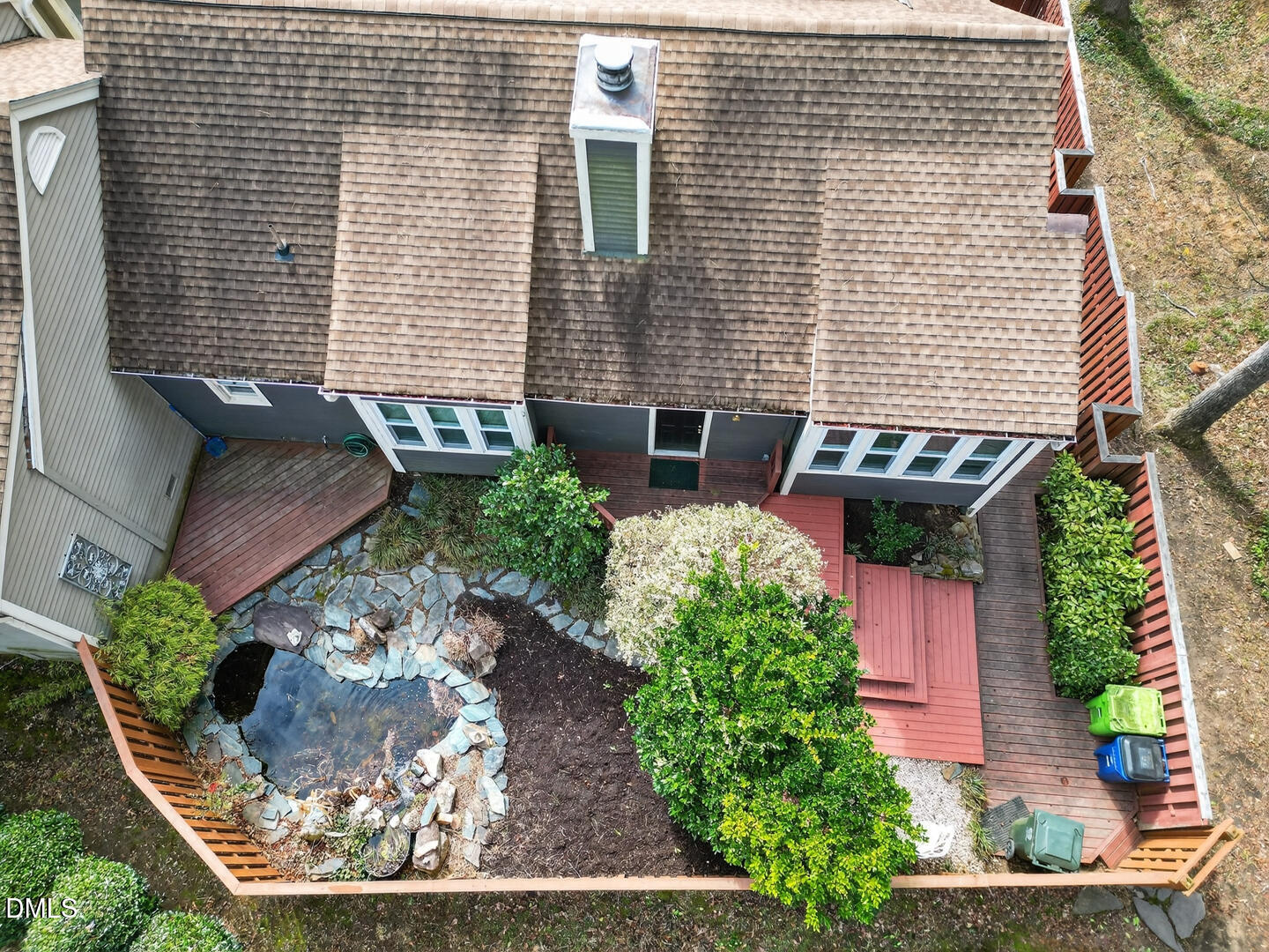 1707 Falls Church Road Raleigh, NC 27609 - Photo 22 of 64 a view of a backyard with plants and outdoor seating