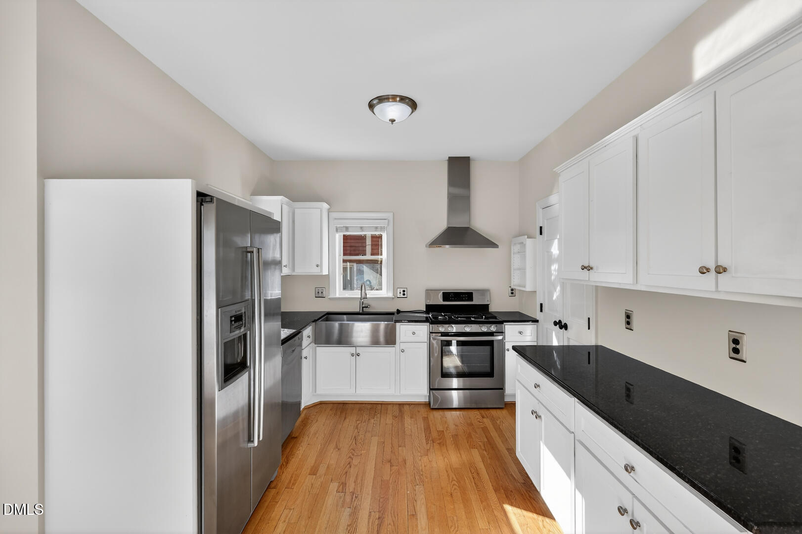 1707 Falls Church Road Raleigh, NC 27609 - Photo 4 of 64 a kitchen with granite countertop a refrigerator stove top oven and sink
