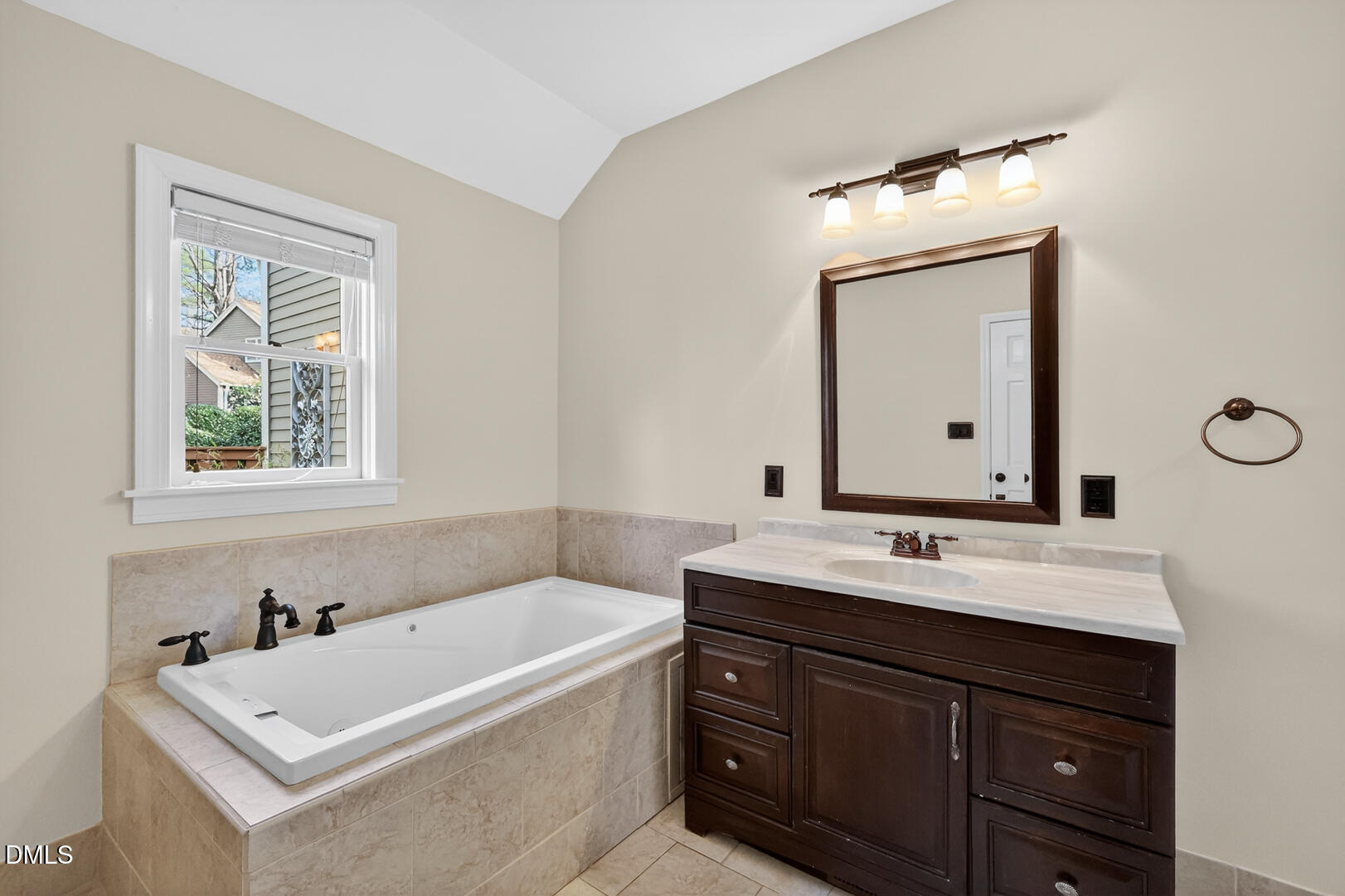 1707 Falls Church Road Raleigh, NC 27609 - Photo 5 of 64 a bathroom with a tub sink and mirror