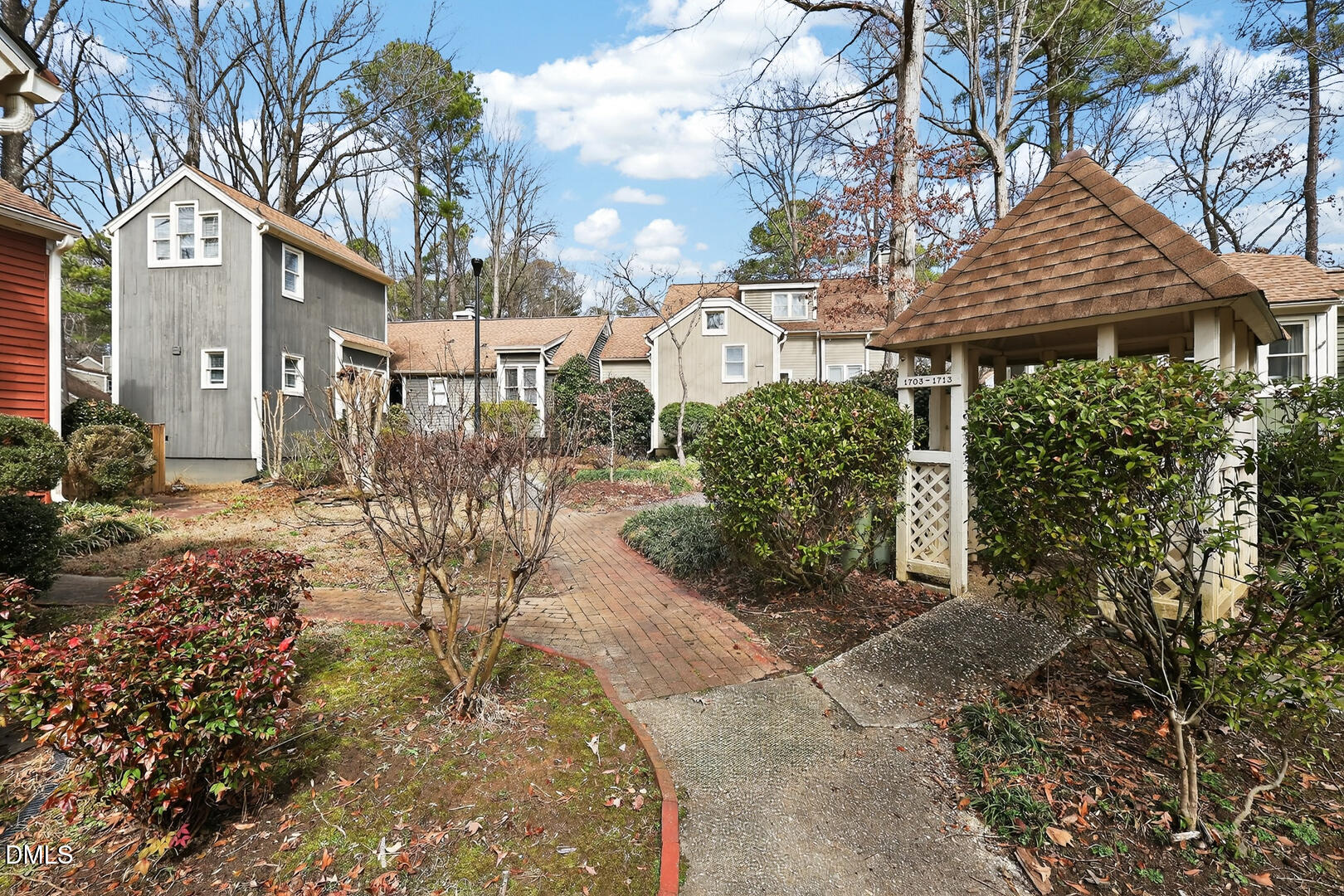 1707 Falls Church Road Raleigh, NC 27609 - Photo 56 of 64 a front view of a house with garden