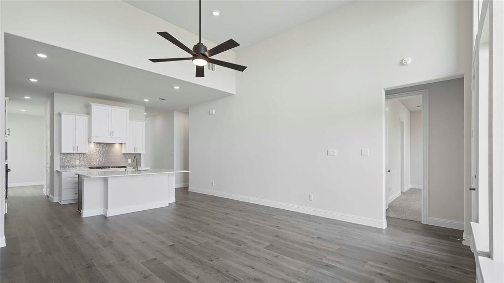 1019 Pitchfork Road Royse City, TX 75189 - Photo 11 of 25 a open kitchen with white cabinets and stainless steel appliances