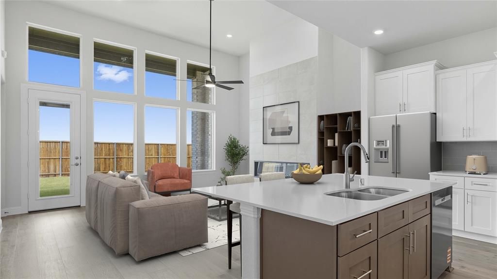 1019 Pitchfork Road Royse City, TX 75189 - Photo 13 of 25 a living room with furniture kitchen view and a large window