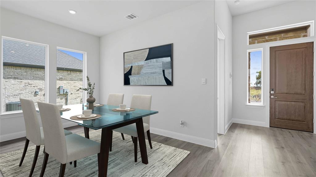 1019 Pitchfork Road Royse City, TX 75189 - Photo 14 of 25 a view of a dining room with furniture window and wooden floor