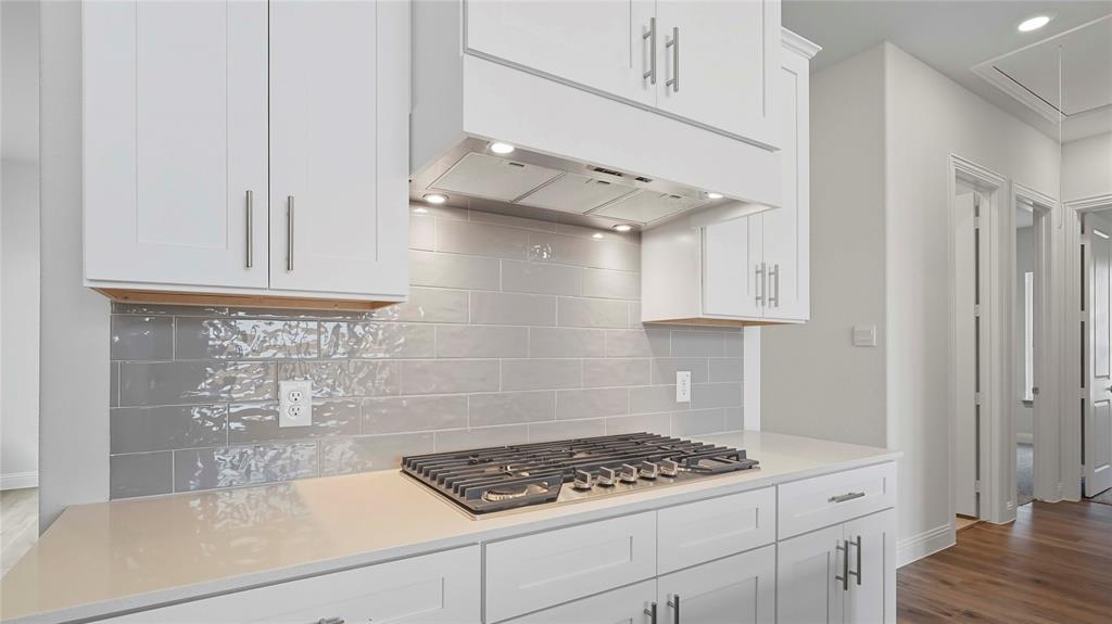 1019 Pitchfork Road Royse City, TX 75189 - Photo 7 of 25 a kitchen with stainless steel appliances a cabinets and a stove top oven