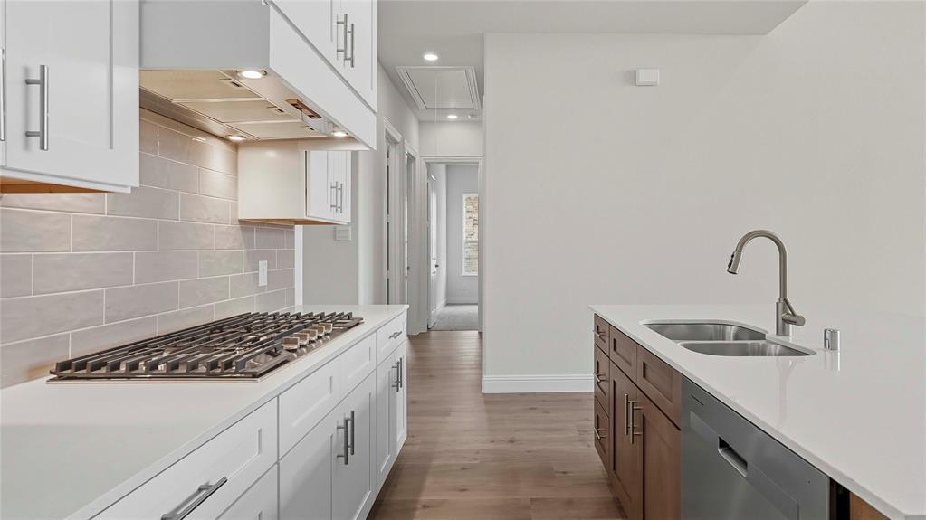 1019 Pitchfork Road Royse City, TX 75189 - Photo 9 of 25 a kitchen that has a sink and a stove