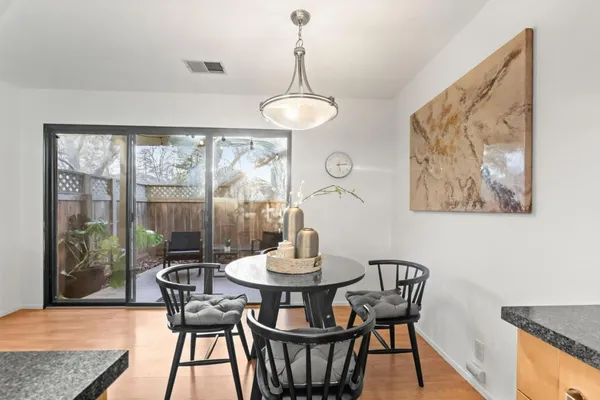 a dining room with furniture and window