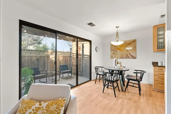 a dining room with furniture and window