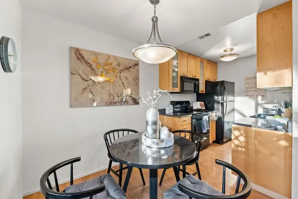a kitchen with a refrigerator stove and microwave