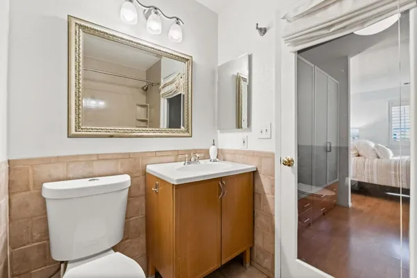 a bathroom with a toilet sink and shower