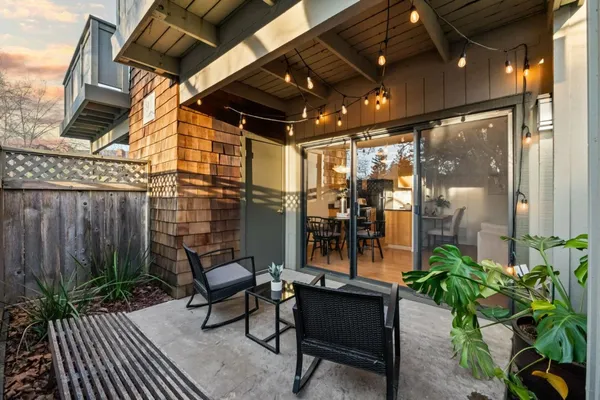 a view of a chairs and table in the patio