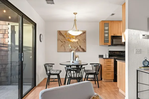 a dining room with furniture and window