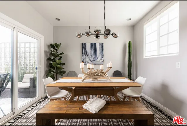 a view of a dining room with furniture window and outside view