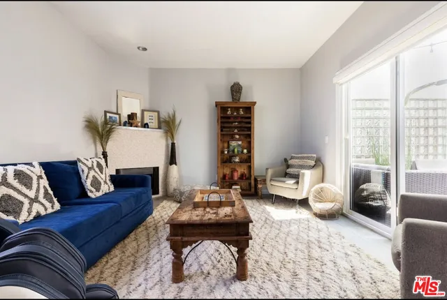a living room with furniture or couch and a large window