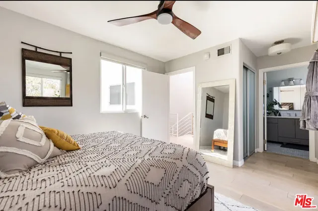 a bedroom with a bed and a view of bathroom