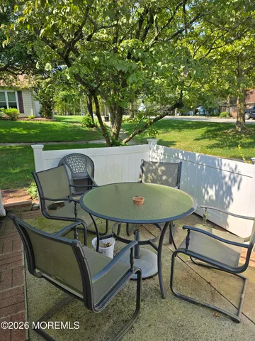 a view of a chairs and table in the patio