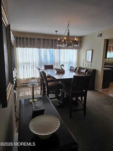 a view of a dining room with furniture