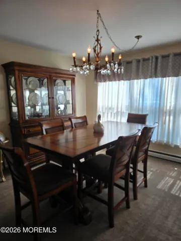a view of a dining room with furniture and window