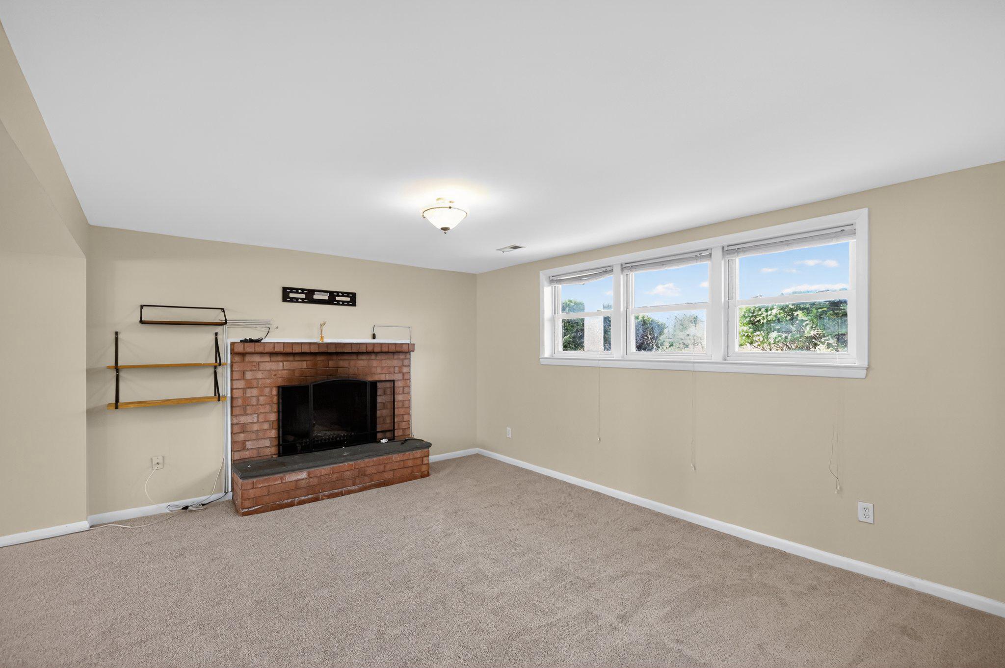 7391 Baldwin Ridge Road Warrenton, VA 20187 - Photo 17 of 32 Basement Recreation Room with Fireplace.