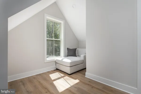a living room with a couch and a window