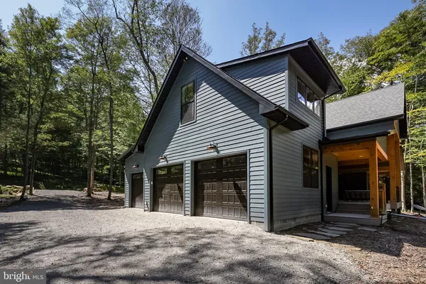 a view of a house with a tree