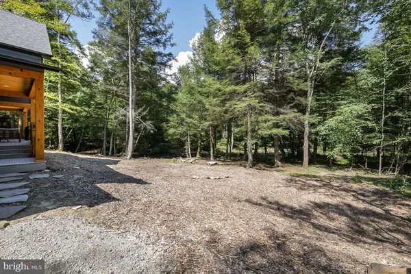 a view of a balcony with couch and wooden floor