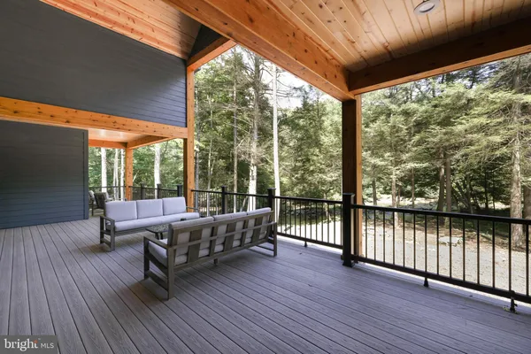 a view of a wooden fence and a floor to ceiling window