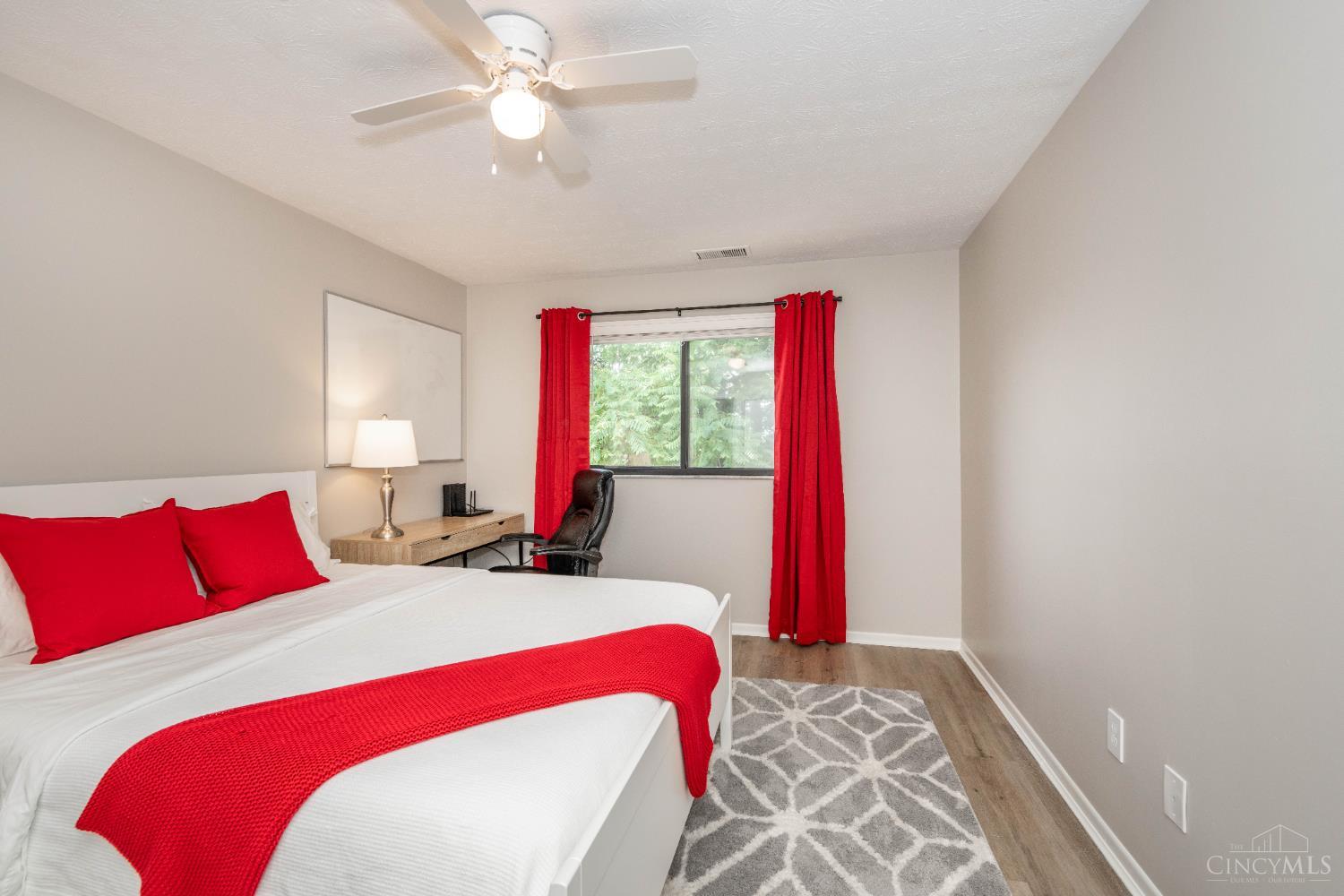 518 Riddle Road, Unit 7 Cincinnati, OH 45220 - Photo 2 of 43 Primary bedroom is very spacious with a desk area an adjoining bathroom. Closet with stacked washer/dryer.