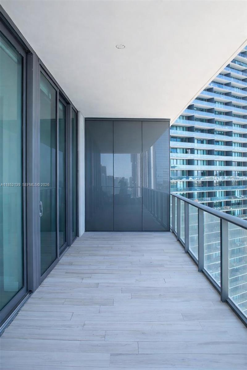 480 Northeast 31st Street, Unit 3301 Miami, FL 33137 - Photo 13 of 32 a view of hallway with stairs