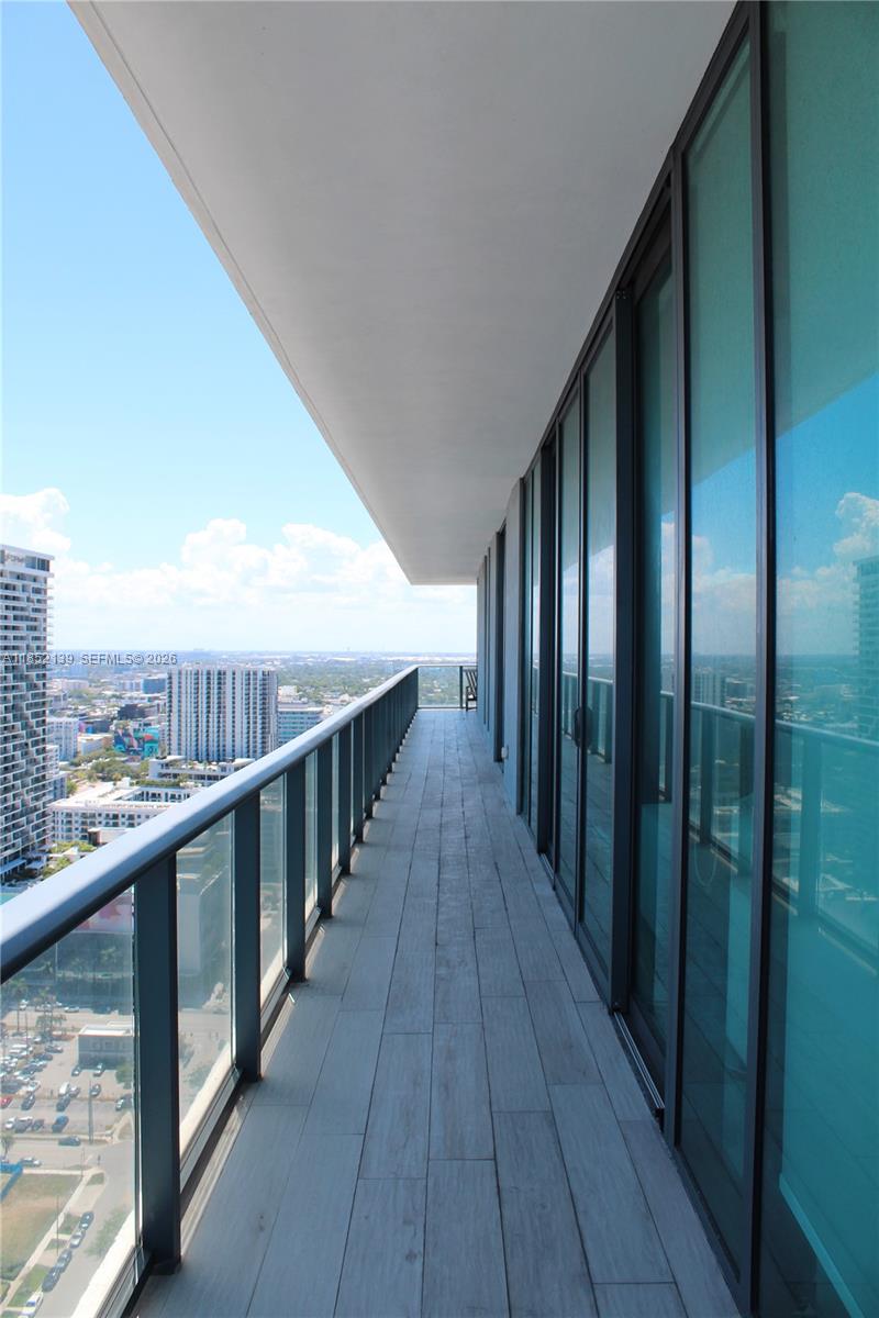 480 Northeast 31st Street, Unit 3301 Miami, FL 33137 - Photo 14 of 32 a view of balcony with wooden floor