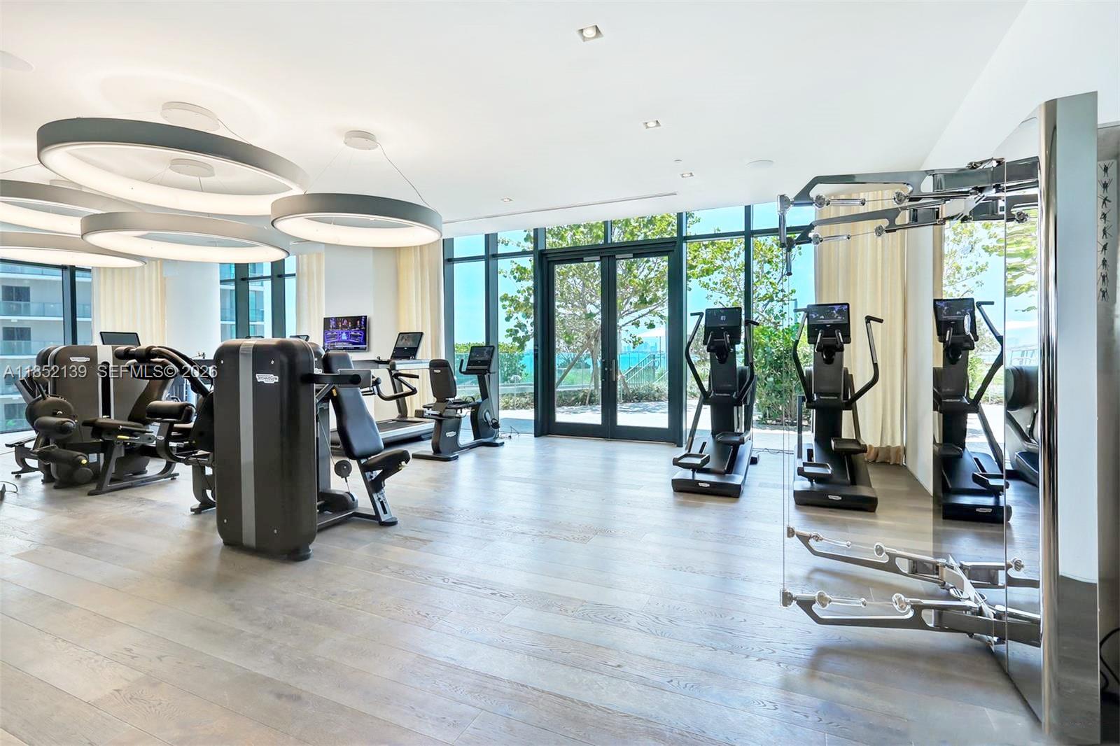 480 Northeast 31st Street, Unit 3301 Miami, FL 33137 - Photo 20 of 32 a view of a room with gym equipment